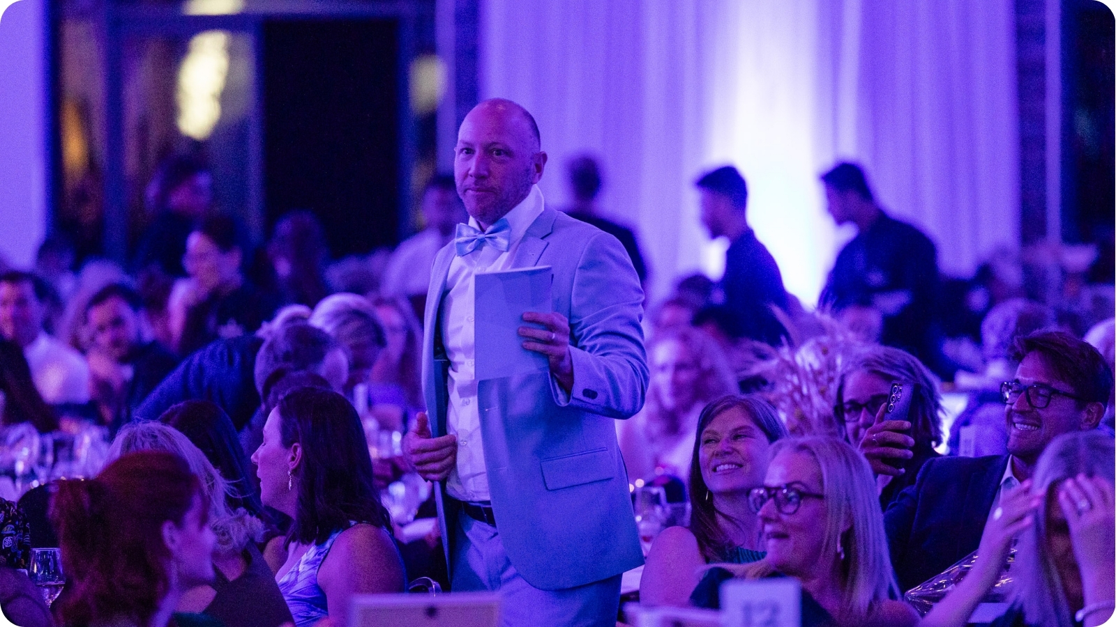 Guests gathered at an evening community event celebrating ocean conservation.