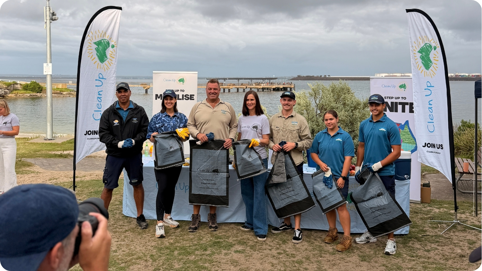 Gamay Rangers with clean-up bags and event banners at Frenchmans Bay.